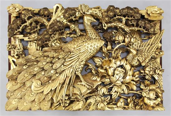 A large Chinese gilt decorated carved wood panel, 20th century, 64 x 102cm